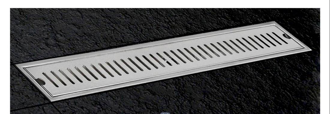 TOKITO linear shower channel on dark stone tile